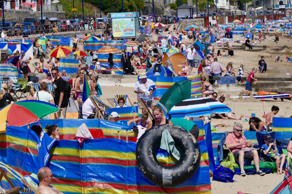  Life's a beach: British beaches like this one in Dorset will be overflowing for the rest of today and tomorrow