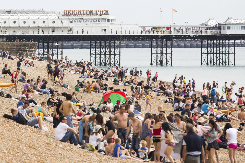  Brighton Pier was inundated with people enjoying the sunshine today as the mercury pushed up to 23C