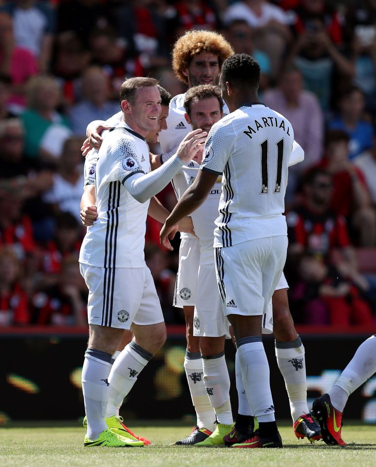 Manchester United celebrate Wayne Rooney's second-half strike