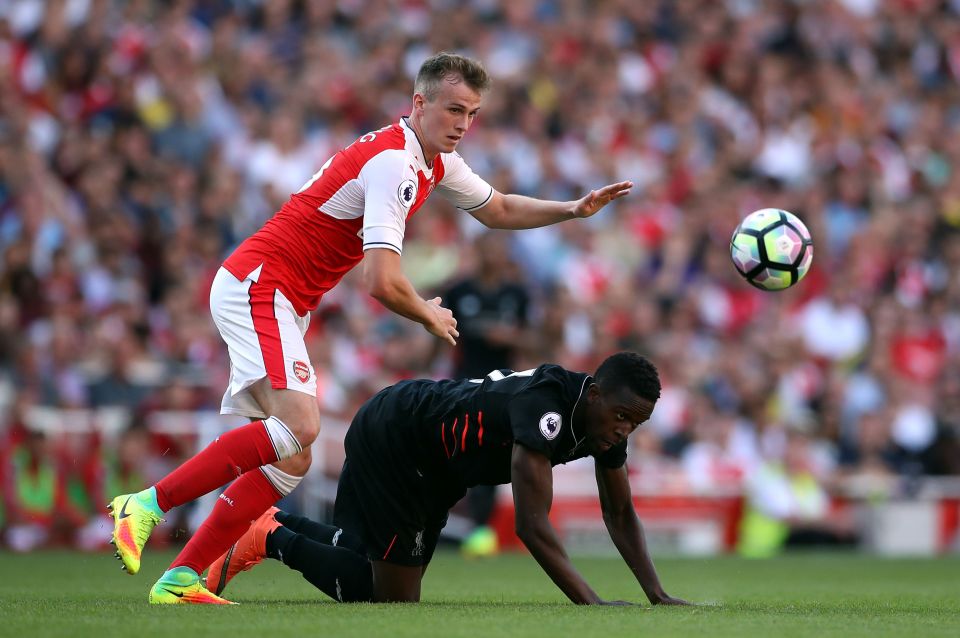  Liverpool's Divock Origi and Arsenal's Rob Holding battle for the ball during the Premier League match at the Emirates