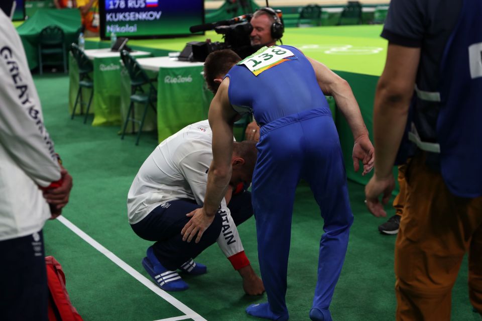  Max Whitlock comforts a distraught Louis Smith after men's pommel horse final