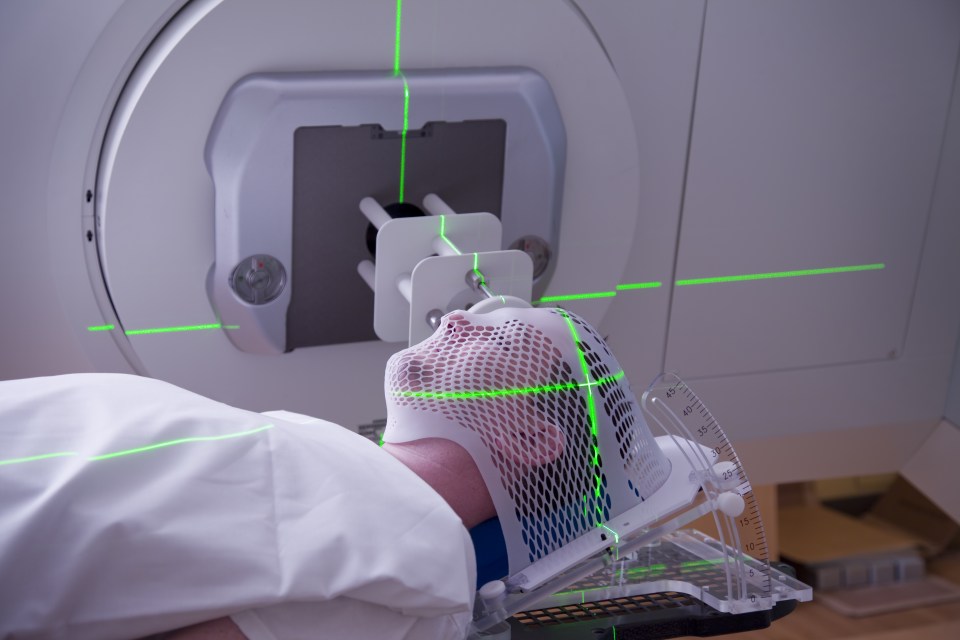  A man receives radiotherapy treatment for cancer