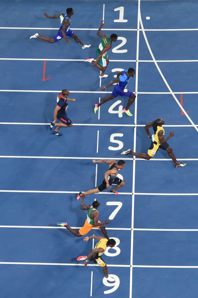  Usain Bolt crosses the line in pole position to win his third consecutive 100 metres final