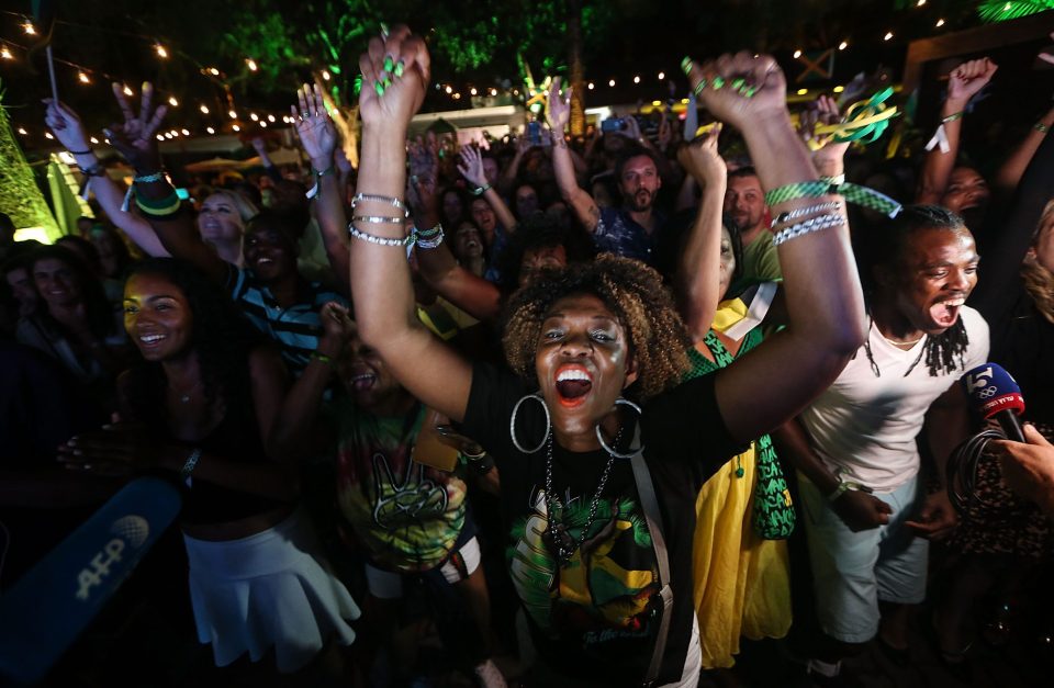  Fans at Jamaica House in Rio cheer following Usain Bolt's win