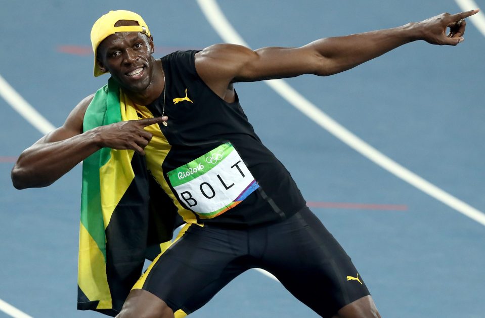  Usain Bolt pulls his Lightning Bolt pose after winning the 100m final