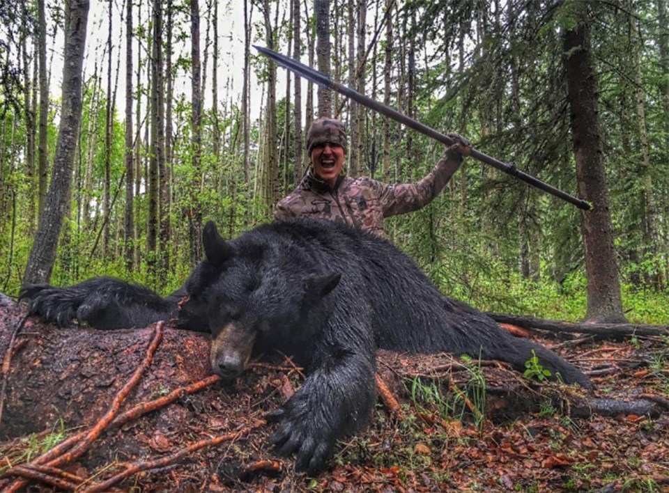  Josh Bowmar takes sick snaps with the body of the dead black bear