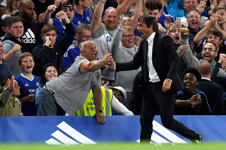  Antonio Conte shows his passion as he celebrates with fans in his first game