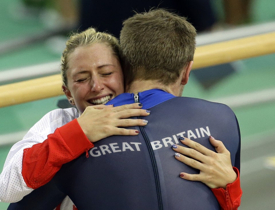 The couple embrace after their achievement