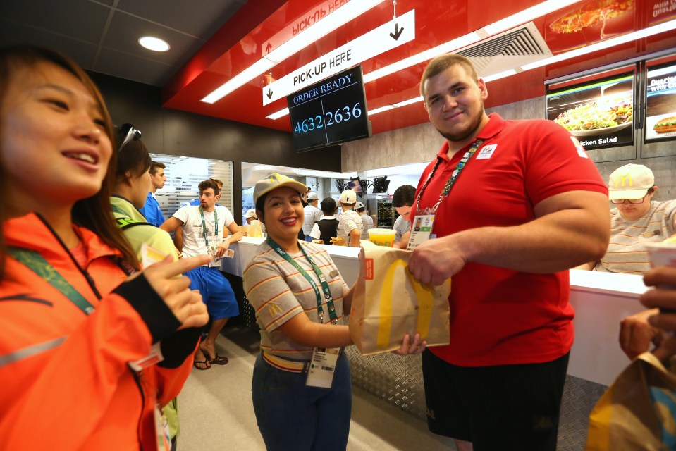  Romanian Judo star Daniel Natea gets his meal from the McDonald's