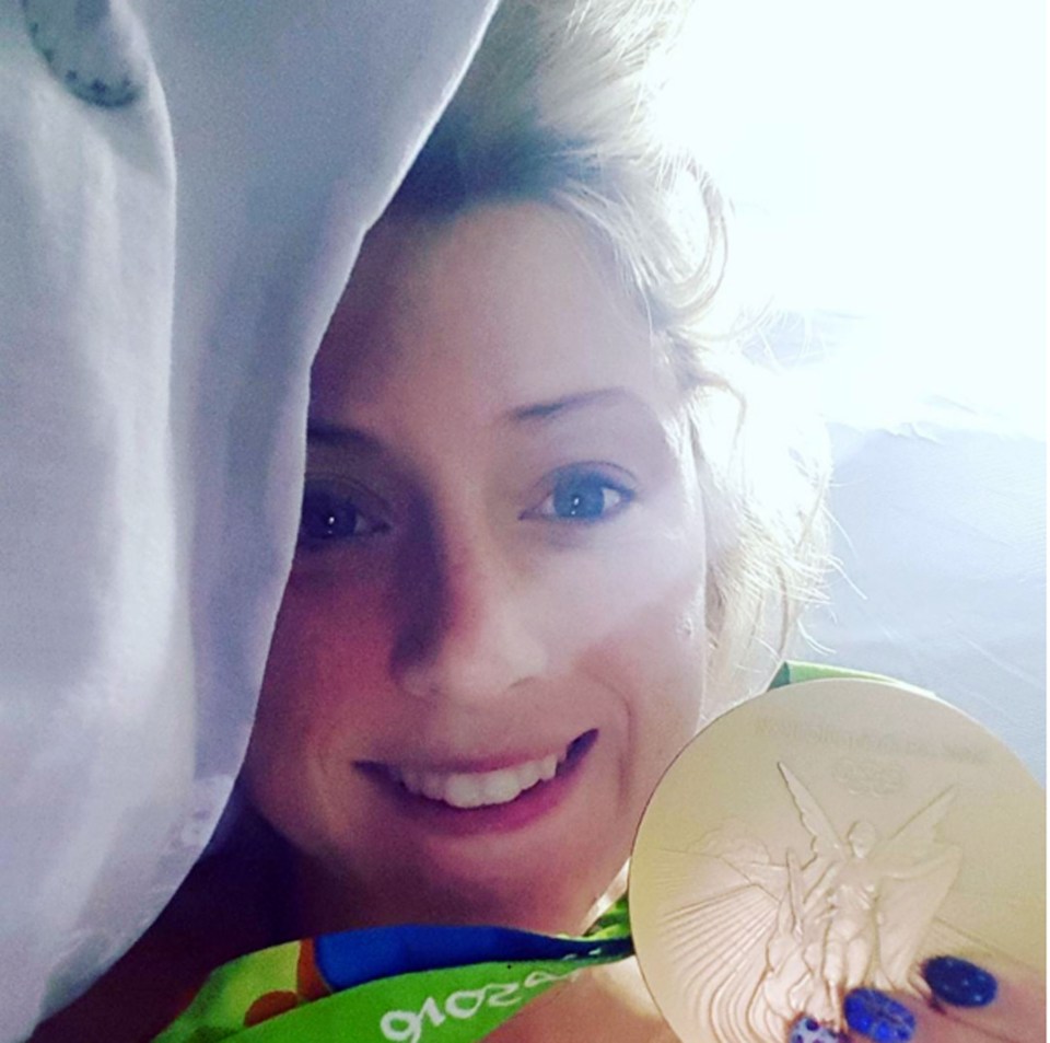  Laura posts a picture in bed with her gold medal