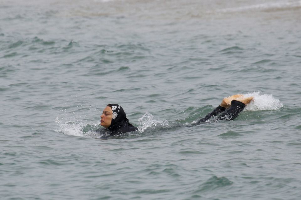  A woman swims off the French coast in a burkini - banned in some French towns