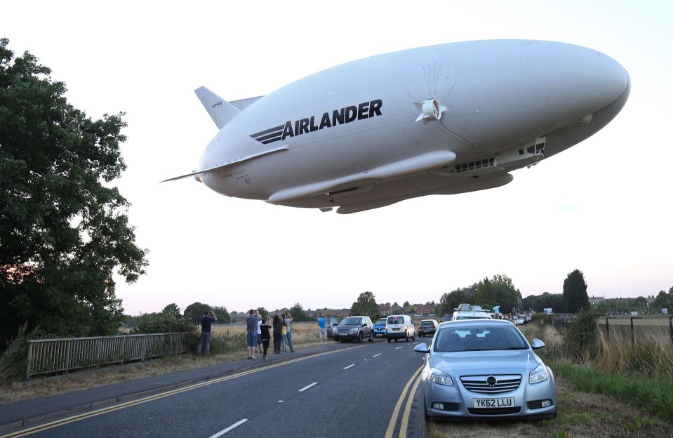  The Airlander 10 looms above a road in Bedfordshire as it takes to the sky for the first time