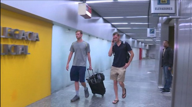 US swimmers Jack Conger and Gunnar Bentz were stopped from flying home on Wednesday