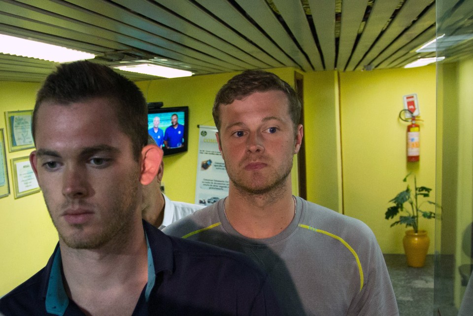  Gunnar Bentz and Jack Conger leave the police station at Rio airport in the early hours of Thursday