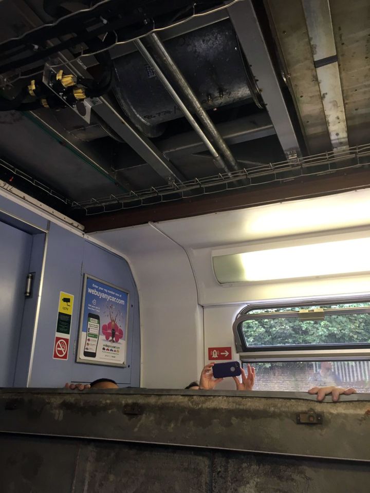  Commuters were left shocked when part of the roof of the train they were on collapsed on them