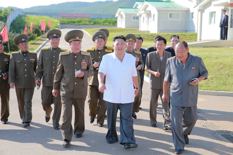  North Korean leader Kim Jong Un visits the Taedonggang Pig Farm with his henchmen