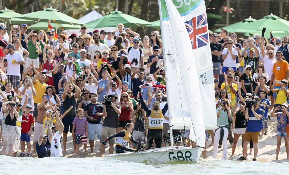  Dozens of family, friends and fans greeted the pair as they beached