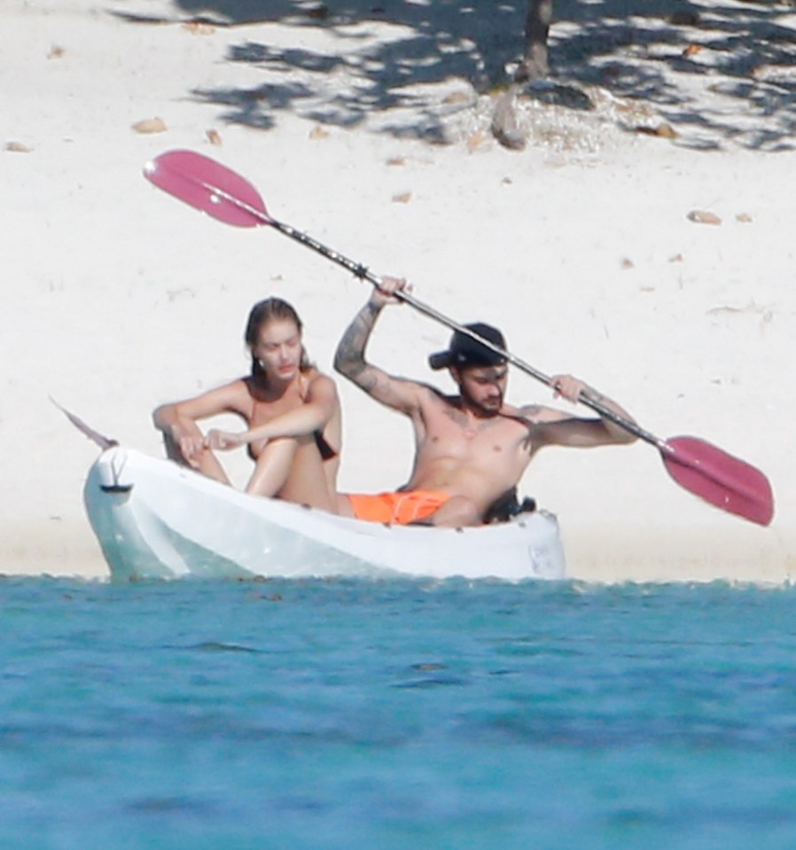  Zayn Malik and Gigi Hadid take to the sea in a kayak in Tahiti