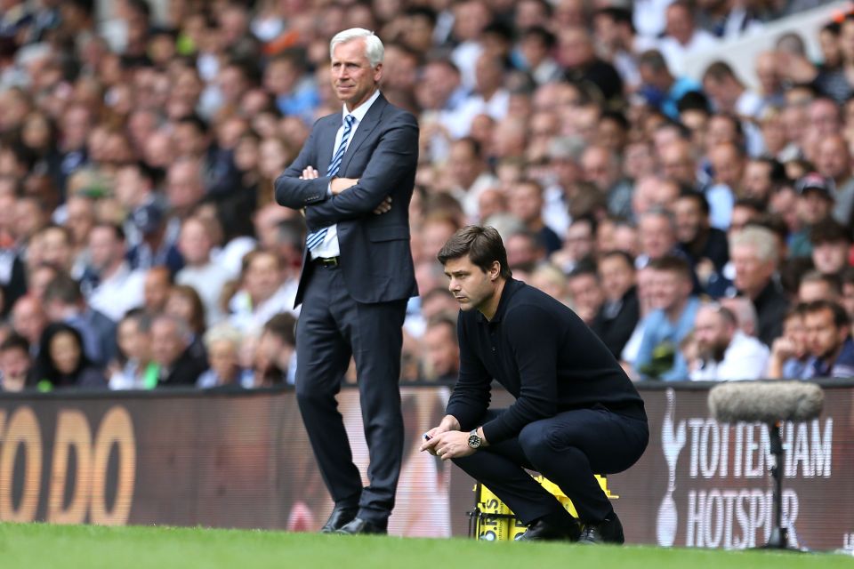  Alan Pardew and Mauricio Pochettino look on during a tense game at White Hart Lane