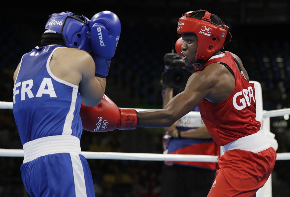  Adams lands a shot on France's Sarah Ourahmoune during the gold medal bout