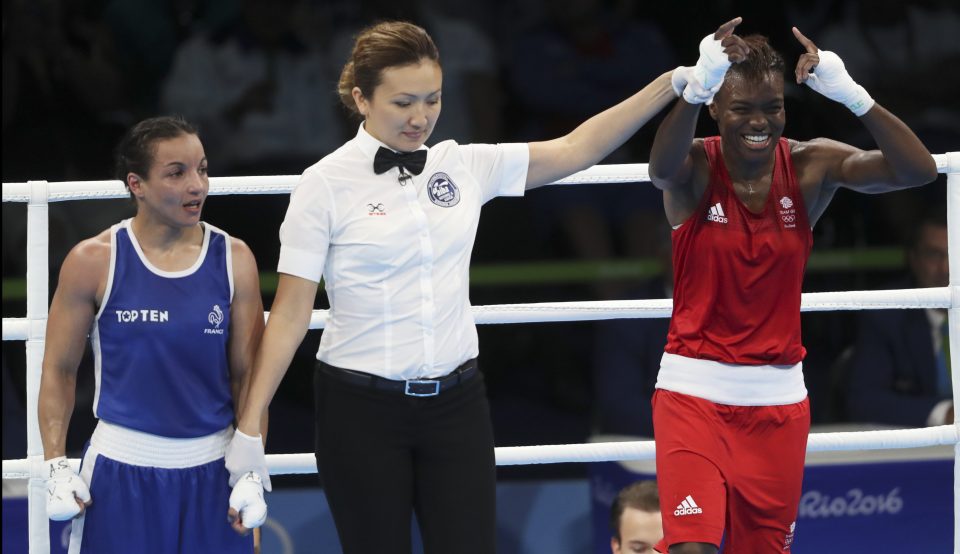  Adams celebrates after she is announced as the double Olympic champion