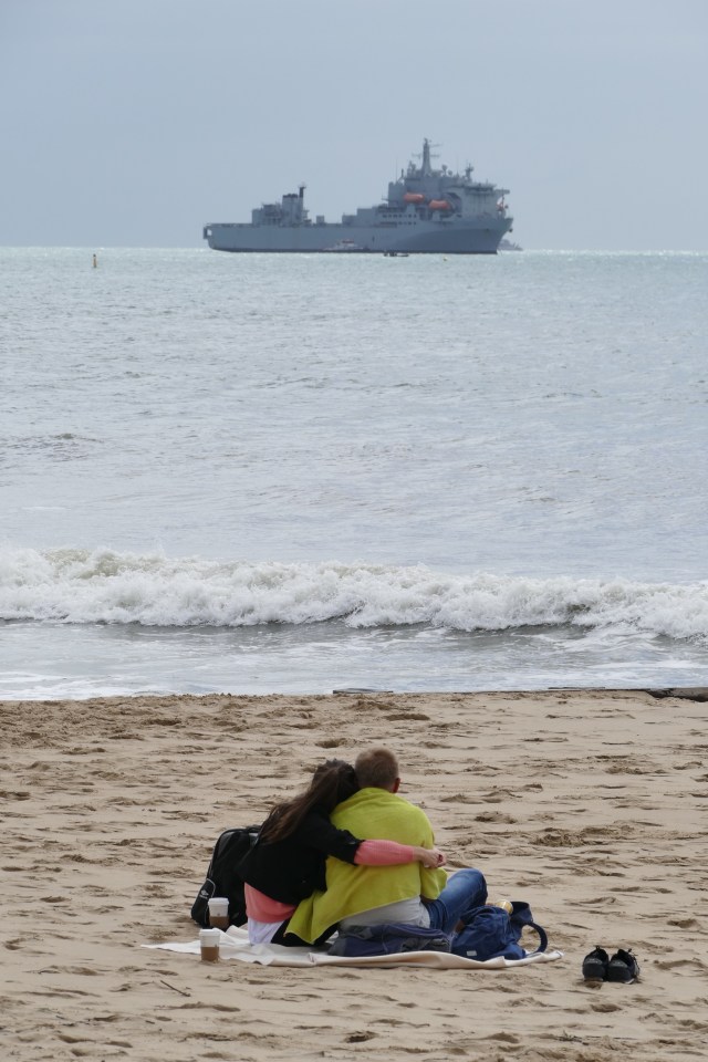  A couple take advantage of the dry weather on Bournemouth beach this morning after a wet and windy couple of days