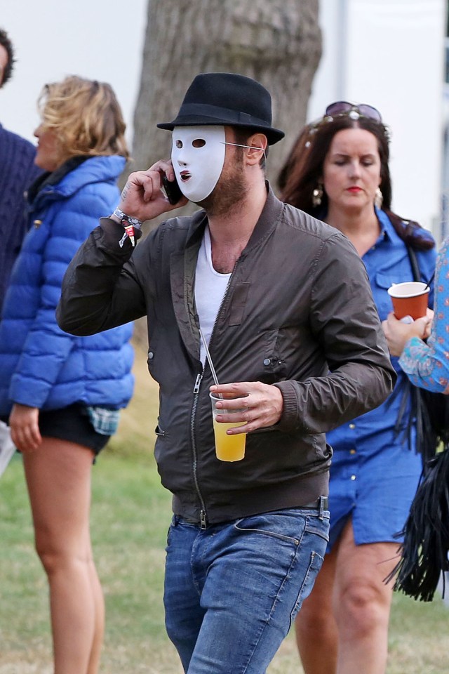  Danny snapped backstage at the festival wearing a mask as a disguise before the row kicked off