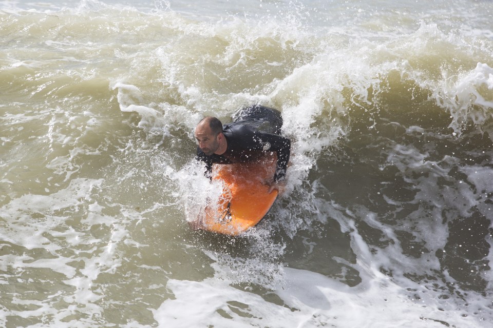  A body boarder takes advantage of the powerful waves and wind in Brighton