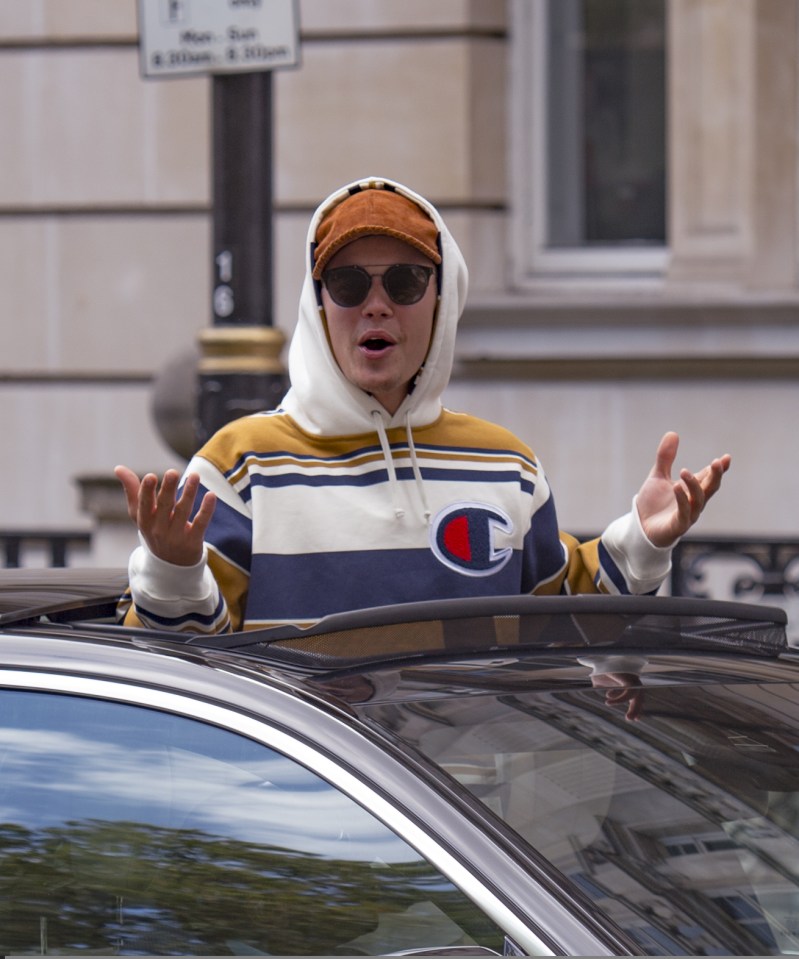 Bieber also hung out of the top of his car at one point to interact with the paparazzi