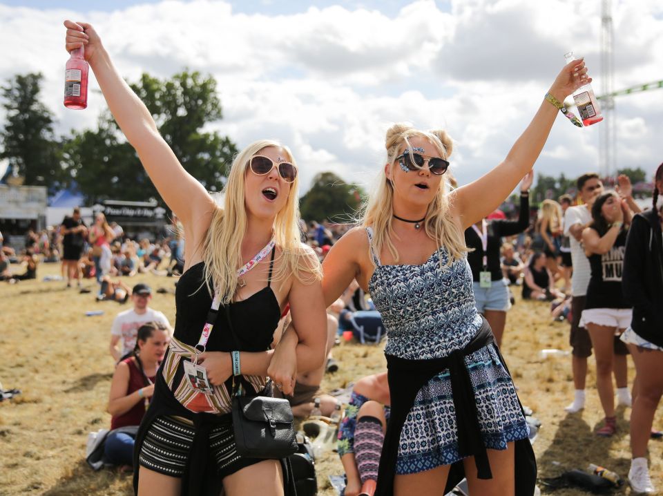  Two festival-goers enjoy the sunshine and balmy weather at V Festival