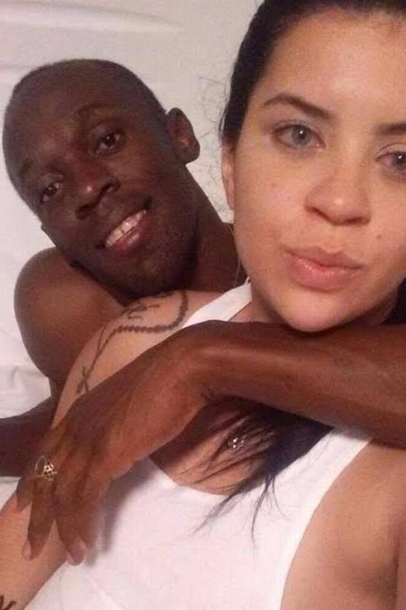  Usain Bolt is pictured in bed with another woman