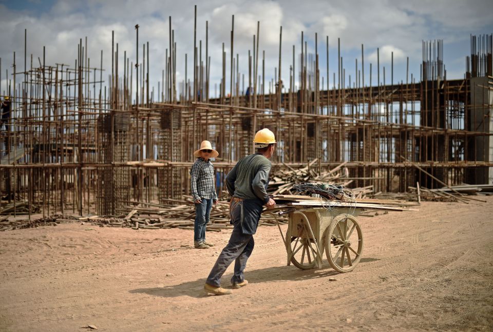  This picture taken on May 5 2015 shows Chinese workers building railway infrastructure on new tracks linking Djibouti with Addis Ababa