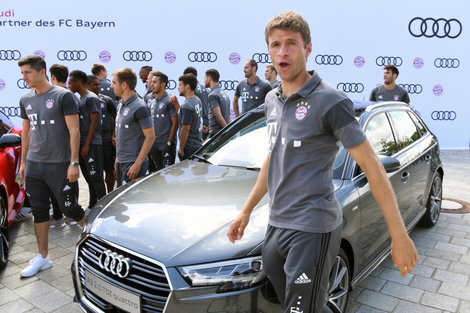  Thomas Muller struts about in front of his brand new supercar