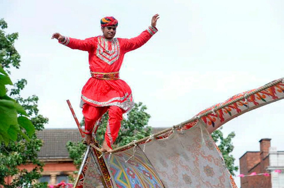  This is the moment a tightrope walker came tumbling off in high winds and landed on his head