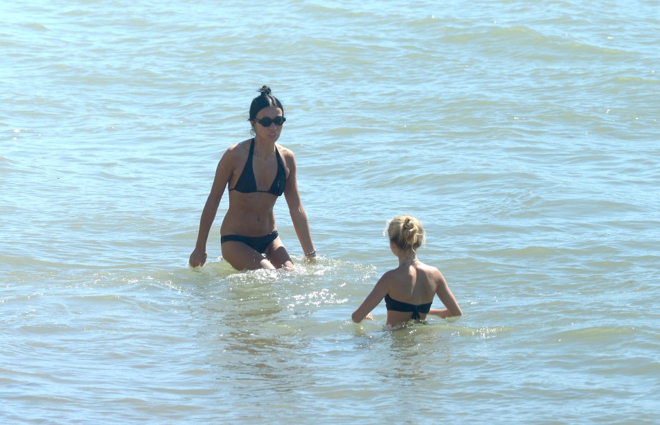  Two girls splash in the sea to cool off in Portsmouth where temperatures sizzled