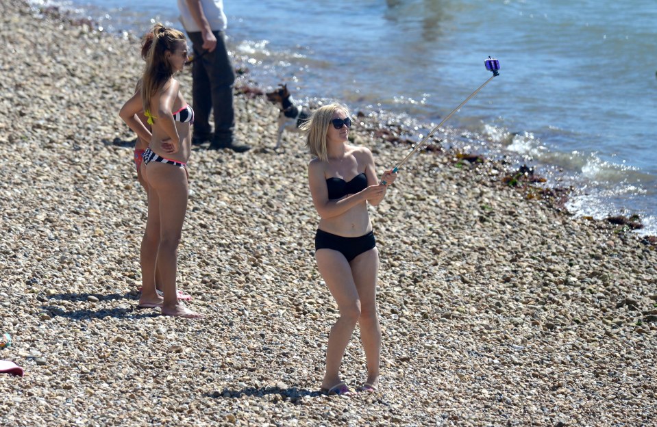  People on Portsmouth beach joked around taking selfies as the mercury nudged 28C today