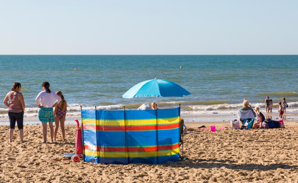  Visitors to Bournemouth beach make the most of the sunshine as temperatures soared