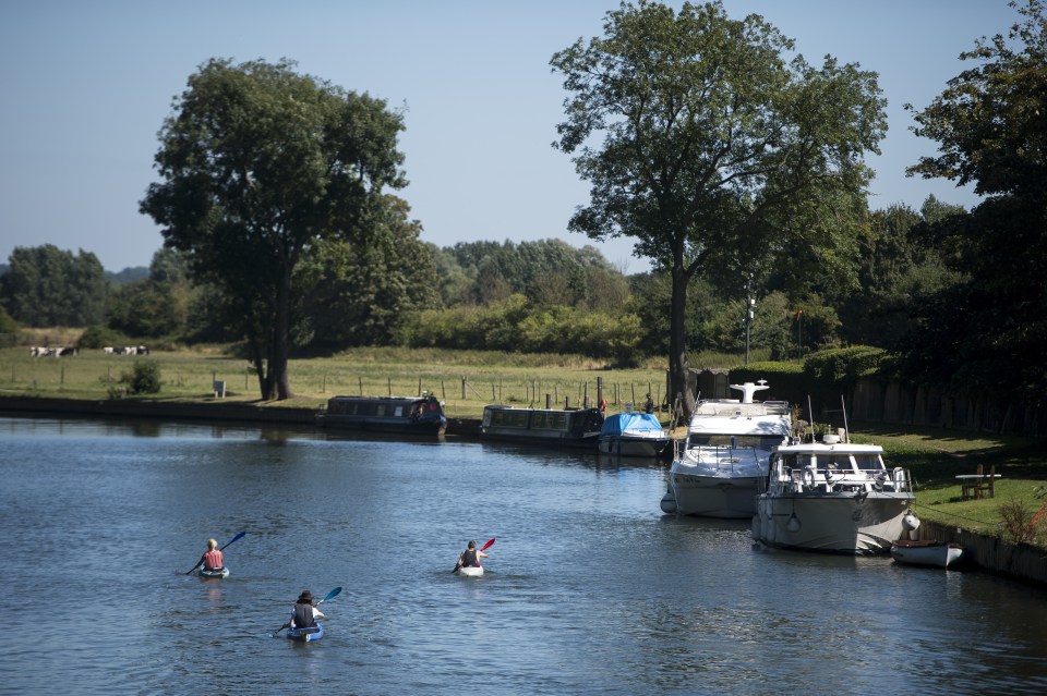  Canoeists take to the River Thames at Sonning in Berkshire where temperatures rose to 30C