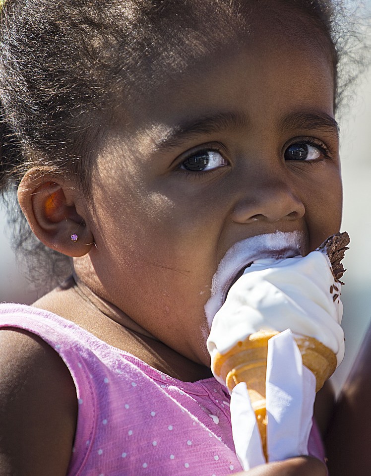  Little Harley cools off with an ice cream on Brighton beach as temperatures topped 28C