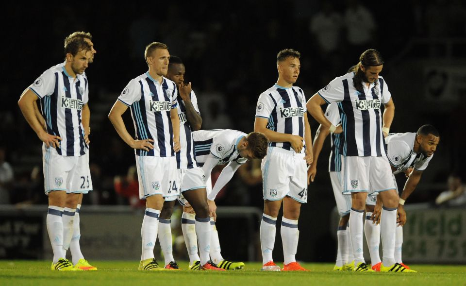  Wilson (5th from the left) alongside his dejected Baggies teammates after Northampton knock them out the EFL Cup