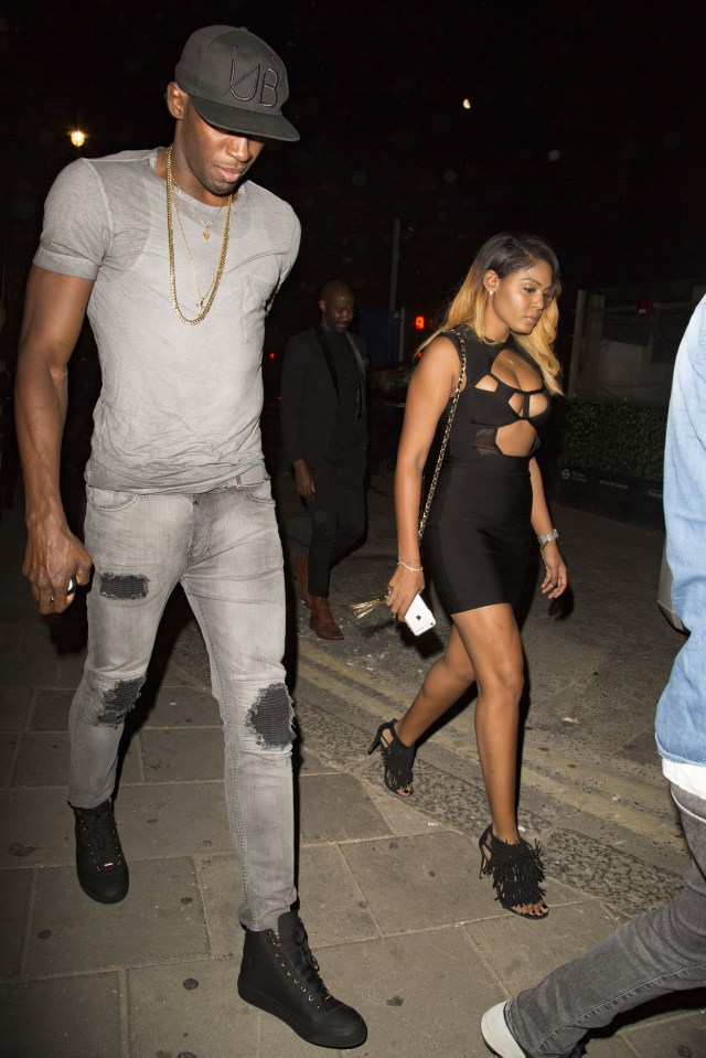  Usain Bolt and a busty brunette walk to Tape Club in Mayfair