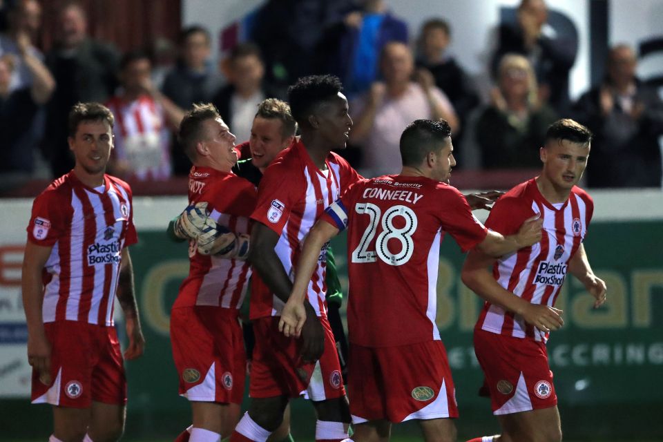 Stanley players celebrate knocking Burnley out of the League Cup