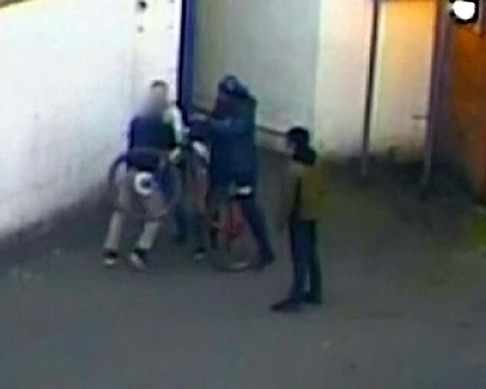  Victim desperately clings onto his bicycle as one of five-strong gang tries to tear it from him