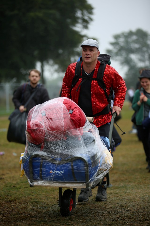  Some festival goers were smart enough to protect their gear as rain fell earlier