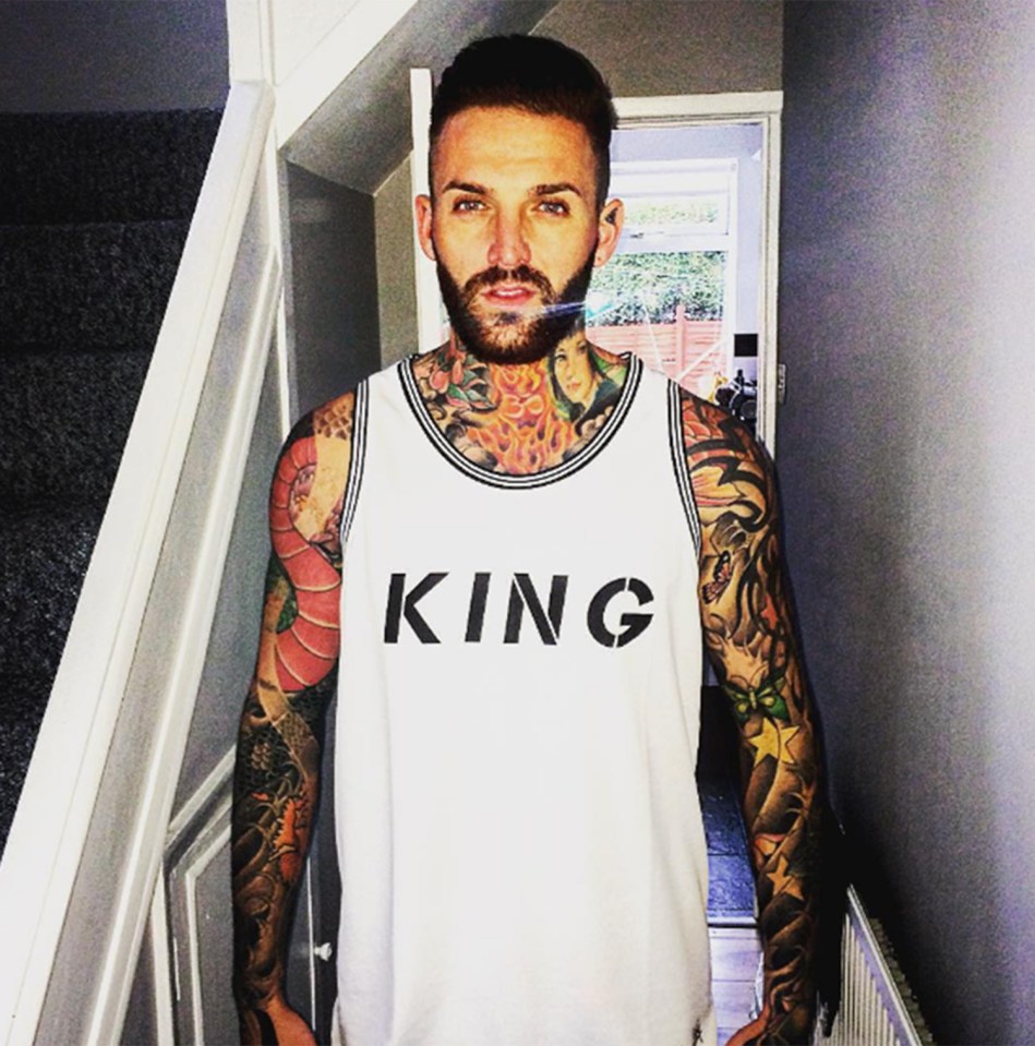  Aaron shows off his tatts in a gym vest