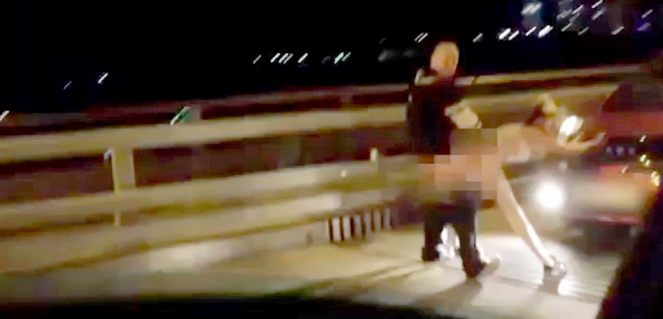  The randy Russians were caught in the act on a roadside bridge in Russia. The whole episode was caught on camera