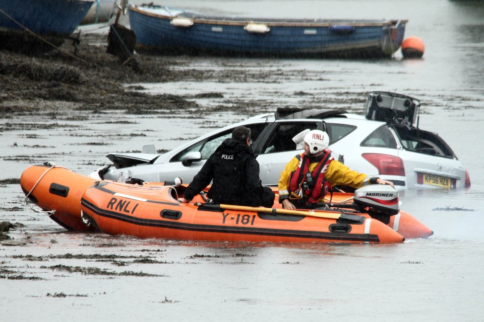  Police and emergency service pictured at the scene of Hooe Lake, Plymouth, Devon, where the tragedy happened