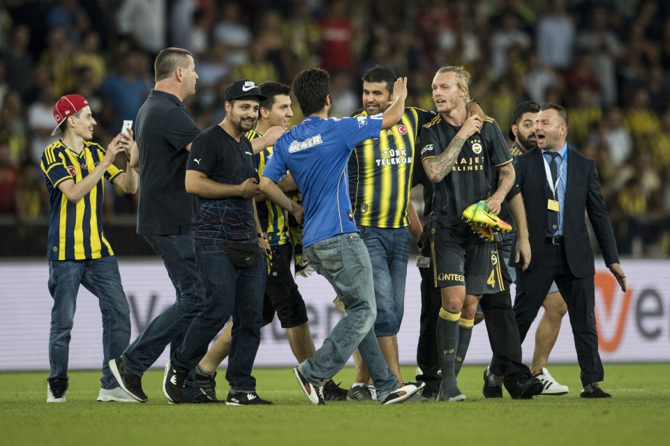  Fenerbahce fans celebrate with Simon Kjaer after second goal on the night