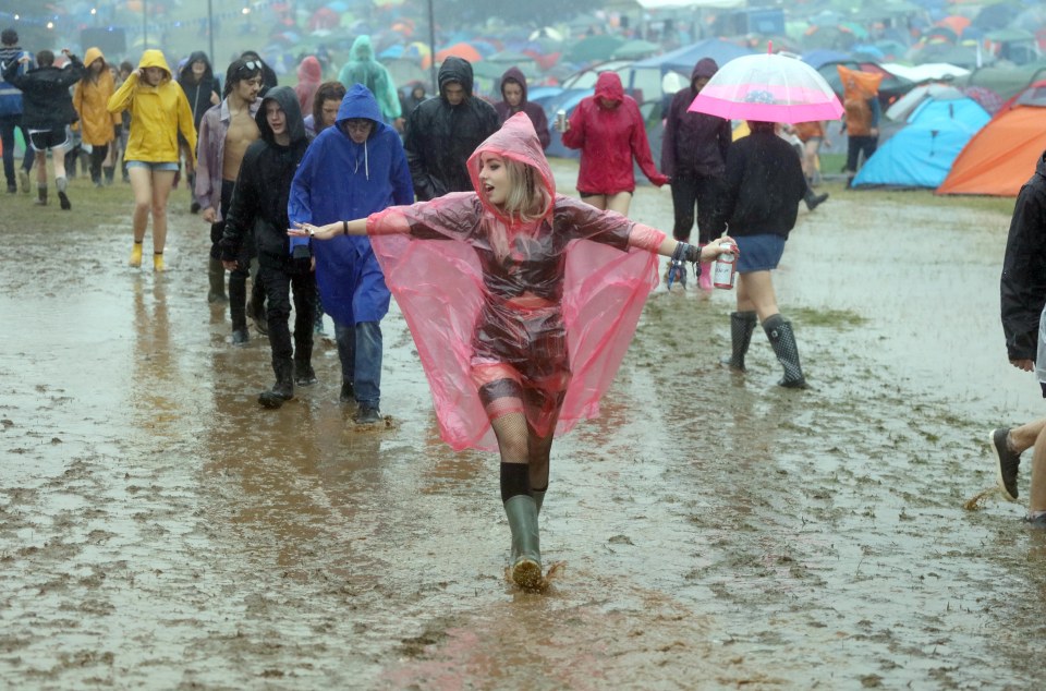  One woman didn't let the downpour dampen her spirits as she danced in the rain