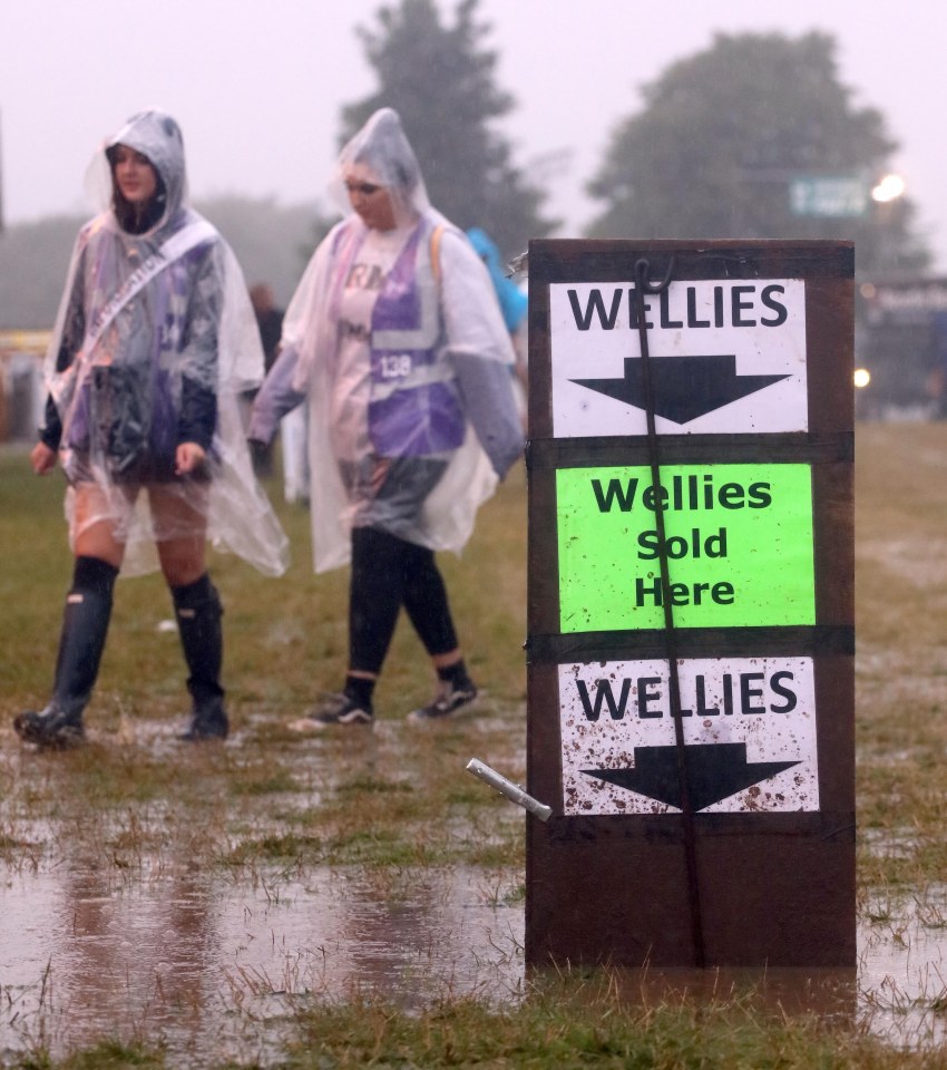  Retailers cash in on the weather as the festival field turns into a mud bath